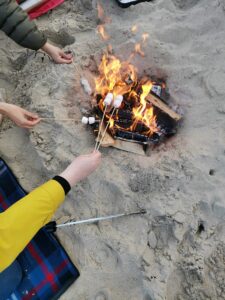 Roasting marshmallows on the beach
